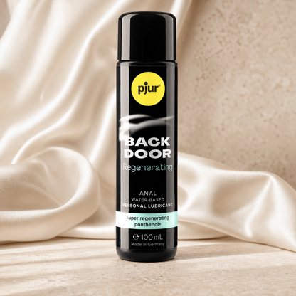 pjur Back Door Panthenol | Gleitgel 100 ml auf hellem Travertin mit Satin